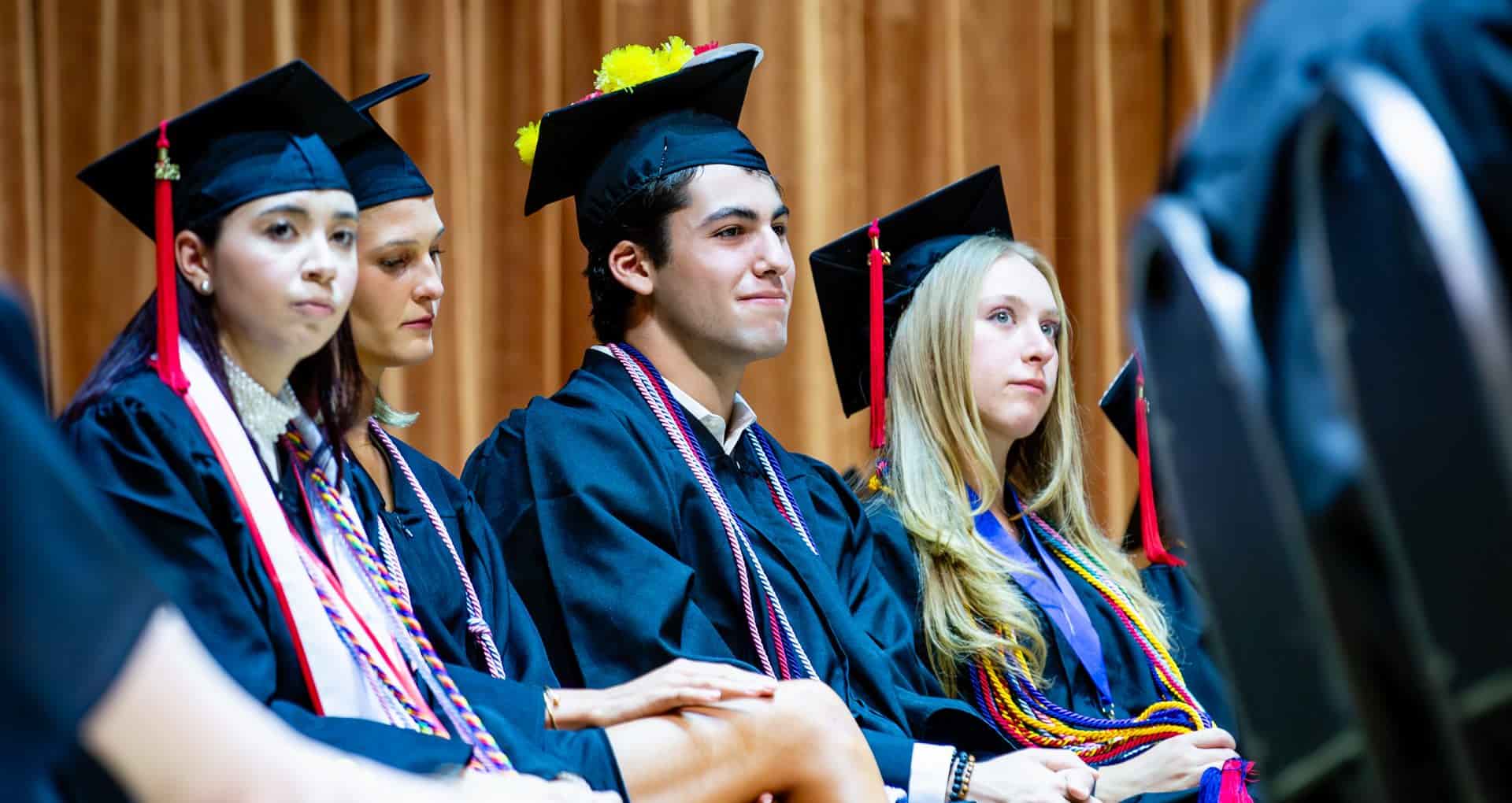MCDS Upper School students in graduation caps and gowns