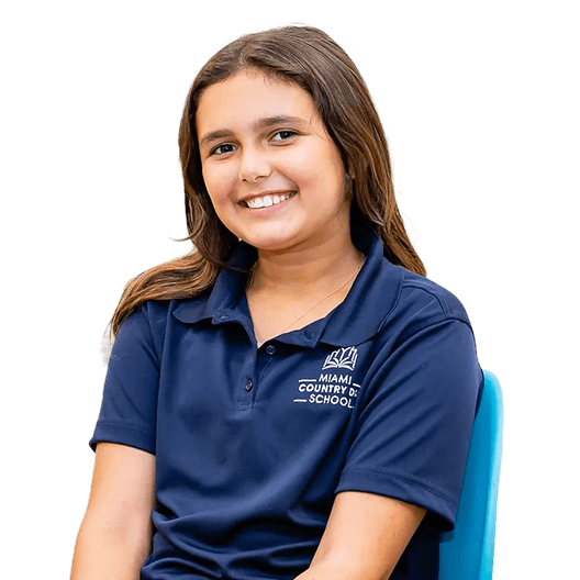 Middle School student smiling in a navy MCDS polo shirt