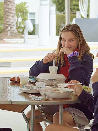 Parent and child looking at a tablet together at MCDS