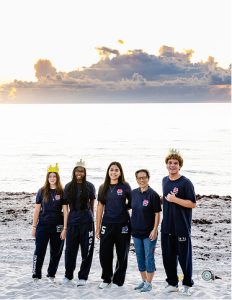 MCDS group posing together at dusk, shown on the About page