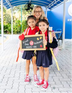 MCDS students holding chalkboards on the first day of school, shown on the About page