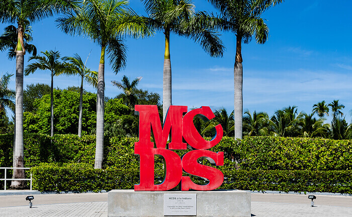MCDS campus sign with red 