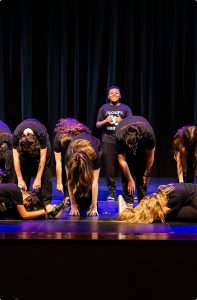 MCDS Theater ensemble performing on stage
