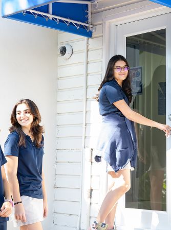 MCDS staff member in a doorway