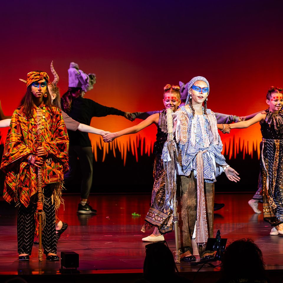 MCDS Theater students in costume performing a scene