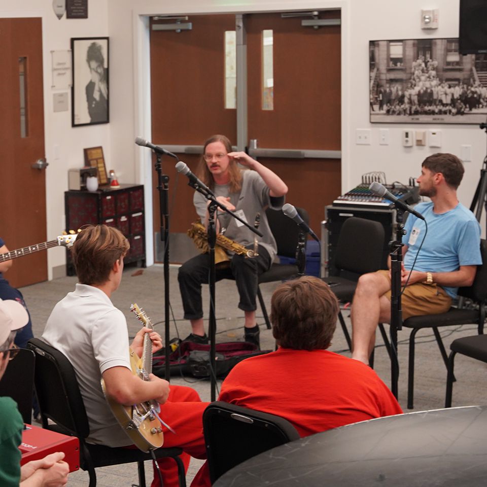 MCDS students playing string instruments in Music class