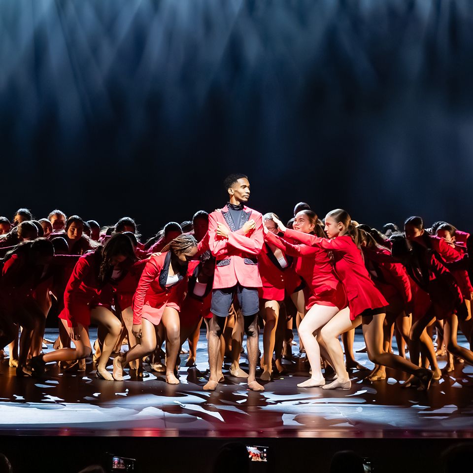 MCDS Dance ensemble performing together on stage