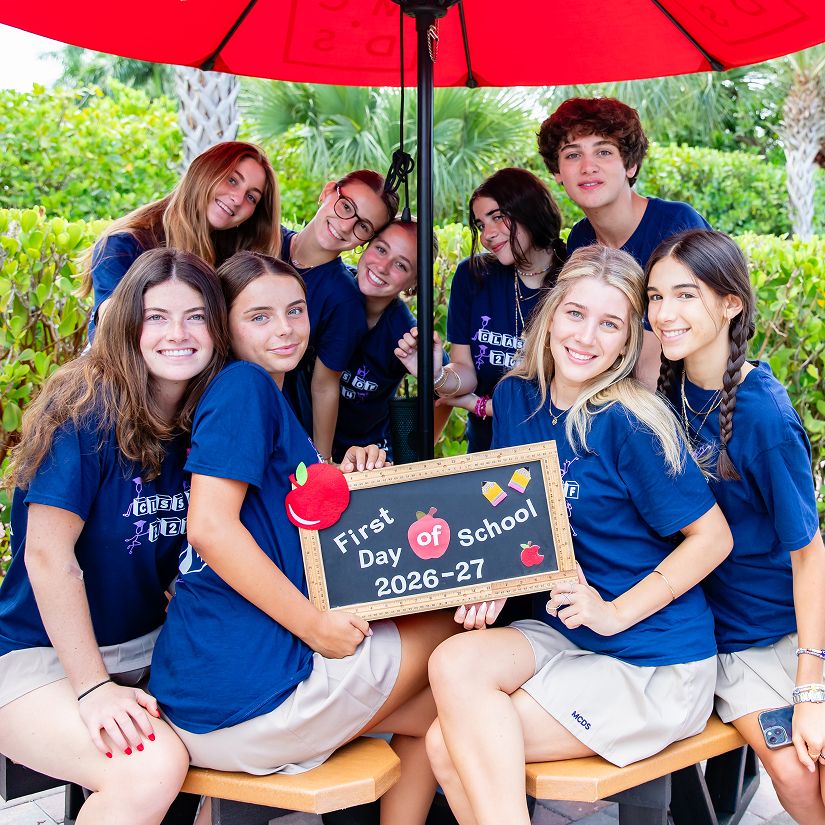 MCDS Lower School students posing together with a project