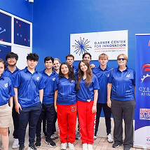 MCDS students posing for a group photo at a robotics event