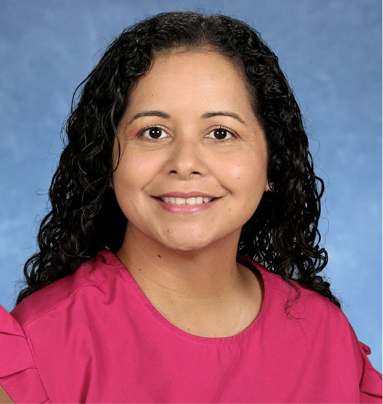Female MCDS staff member smiling in a professional school portrait