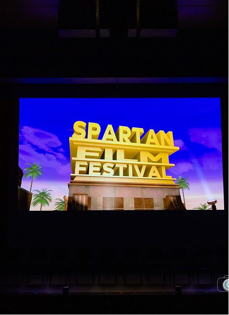 Spartan Festival title screen projected on stage