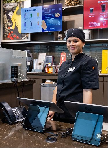 SAGE Dining chef standing at the cafe service counter