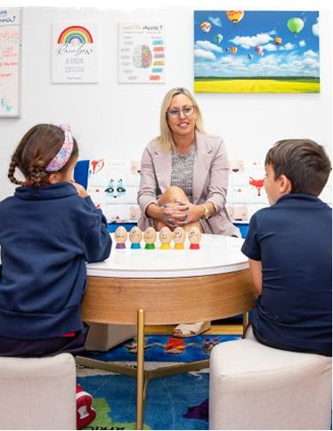 MCDS students working together with a faculty member