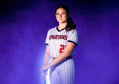 MCDS softball player poster graphic for the Sport Programs page