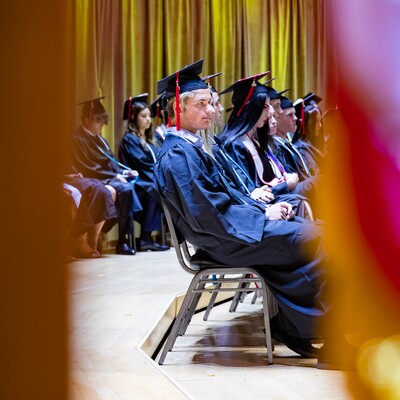 Graduates seated in caps and gowns during the Commencement ceremony