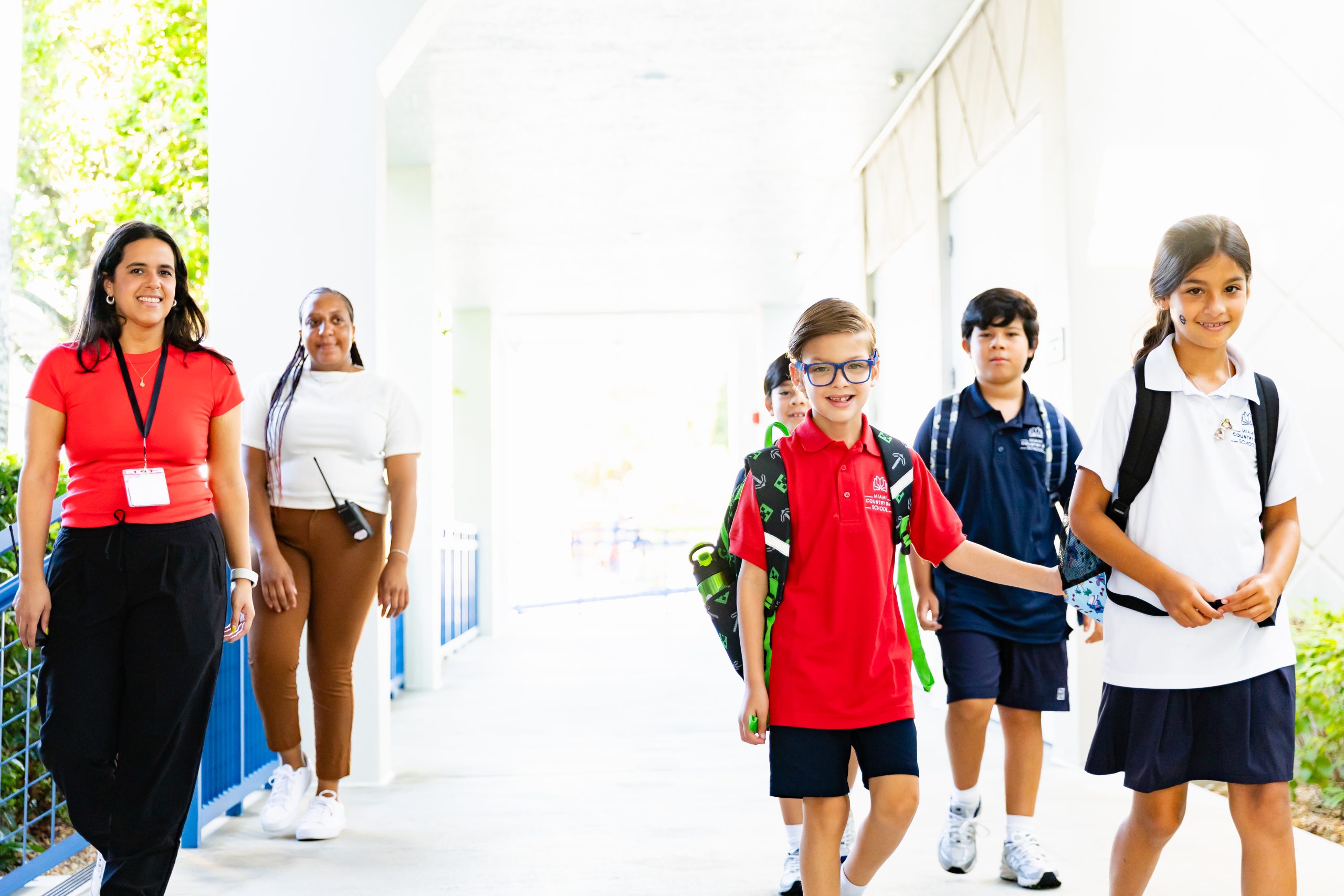 MCDS families walking on campus on the first day of school, shown on the Auxiliary Programs page