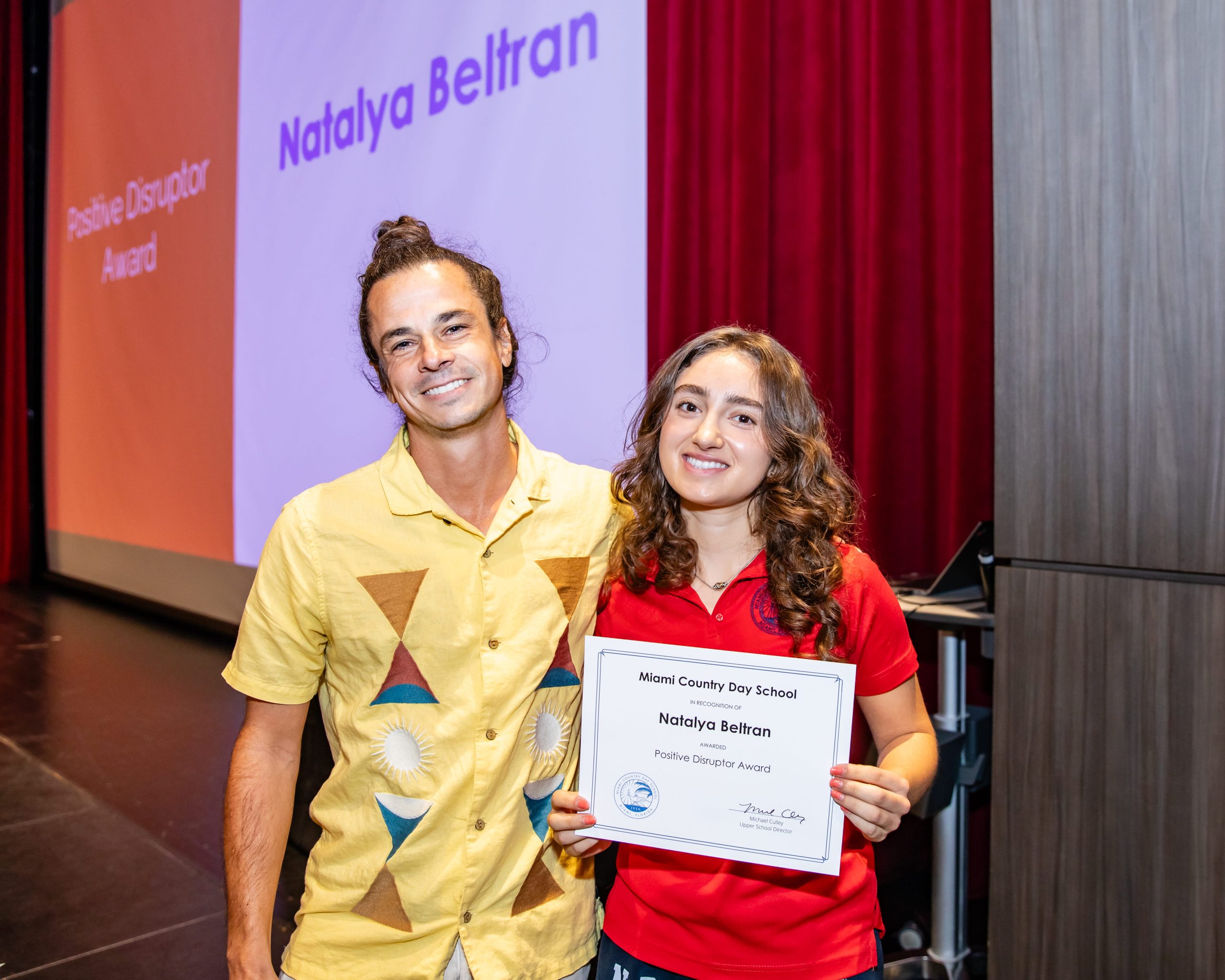 MCDS student receiving a Senior Award on stage