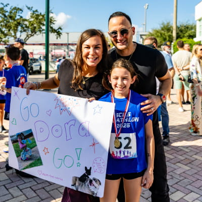 MCDS community members celebrating at a triathlon event