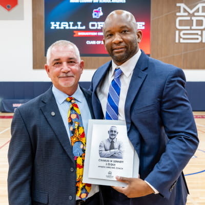 MCDS Athletic Hall of Fame honoree posing with an event attendee