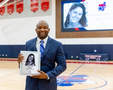 MCDS Hall of Fame honoree holding a plaque