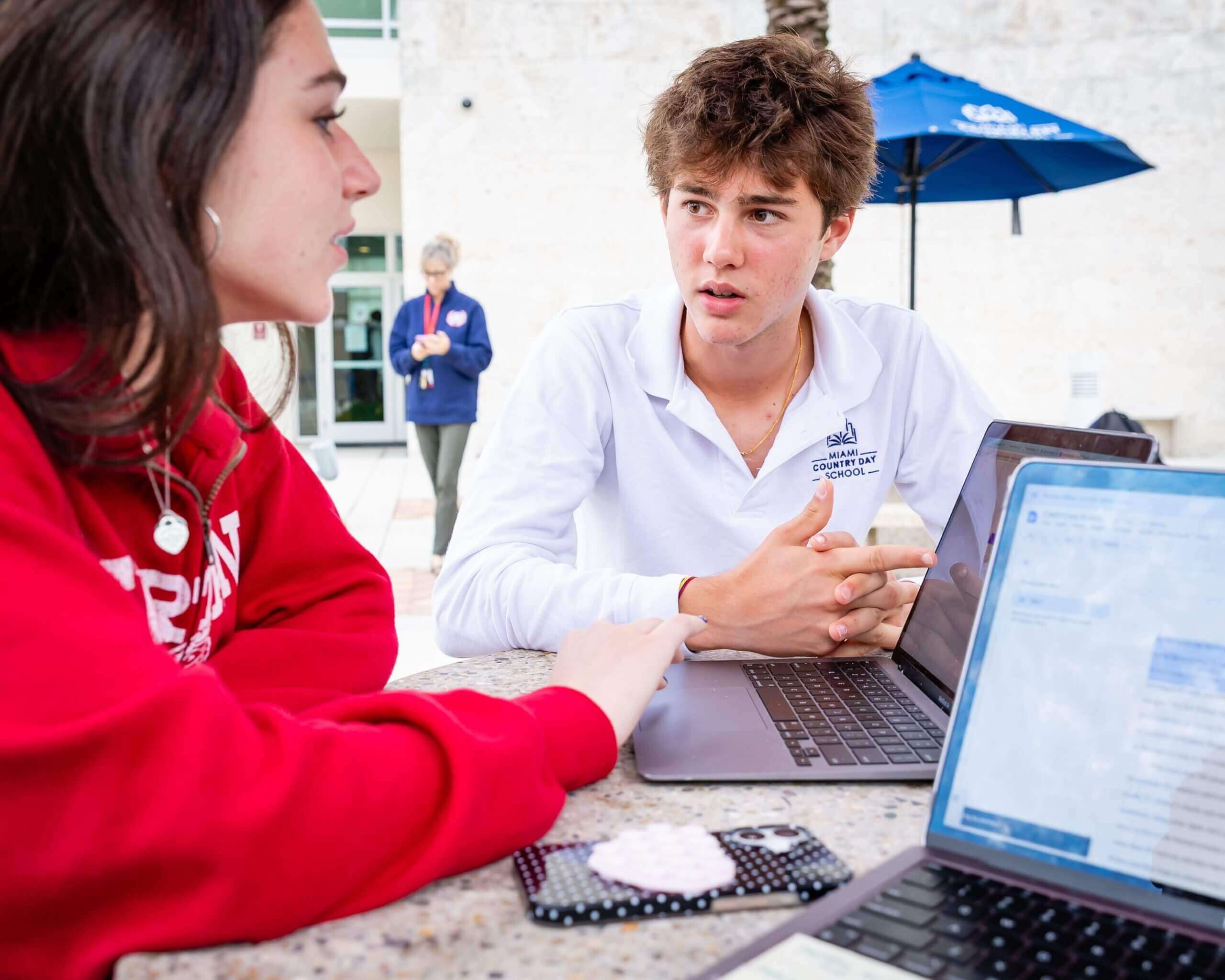 MCDS Upper School students talking together outside