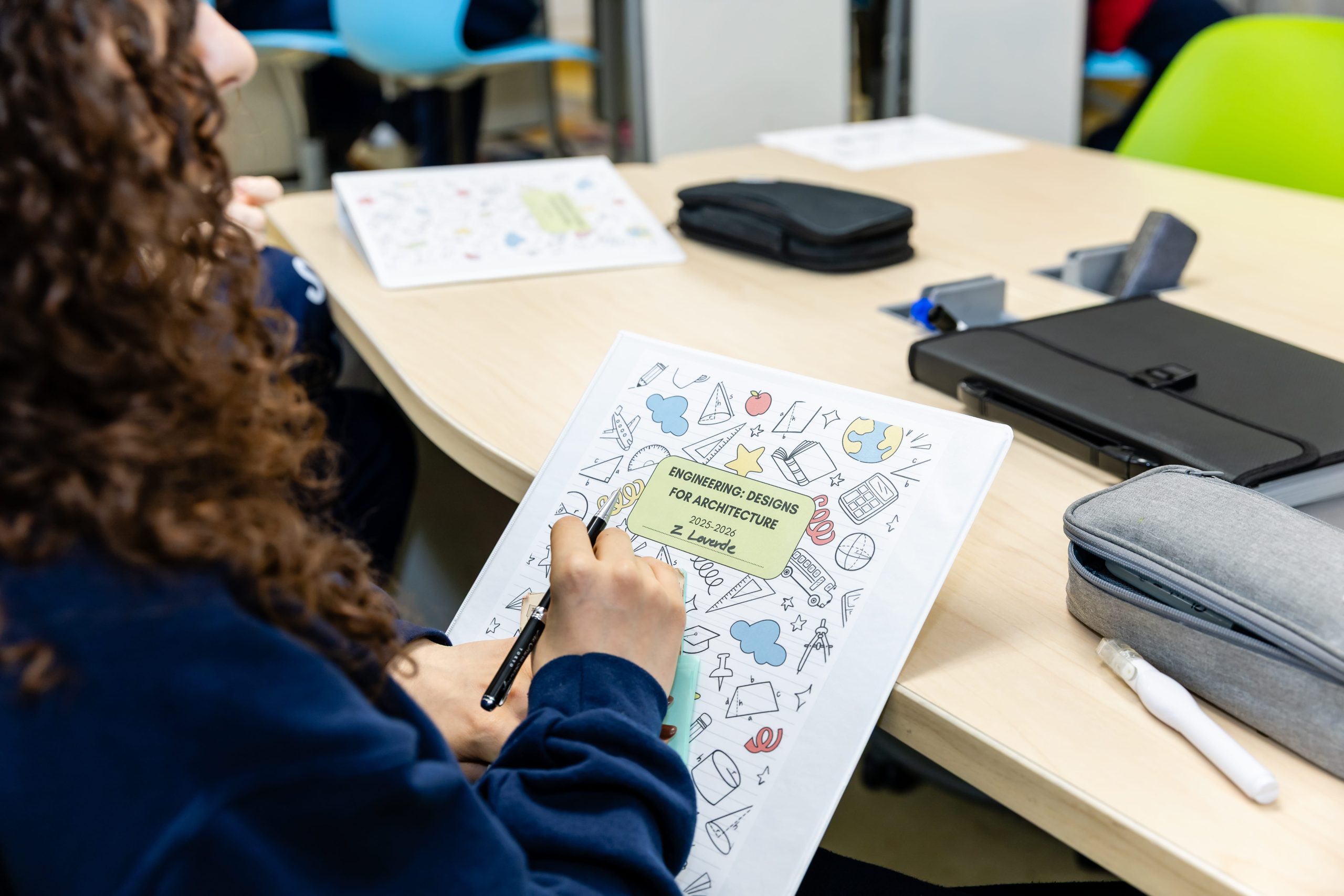 MCDS staff member reviewing documents at a desk