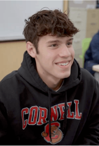 MCDS student smiling in a Cornell t-shirt, "A Student's Journey" thumbnail