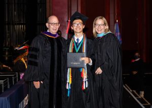 MCDS alumnus Andrew Weaver ’21 at a graduation ceremony