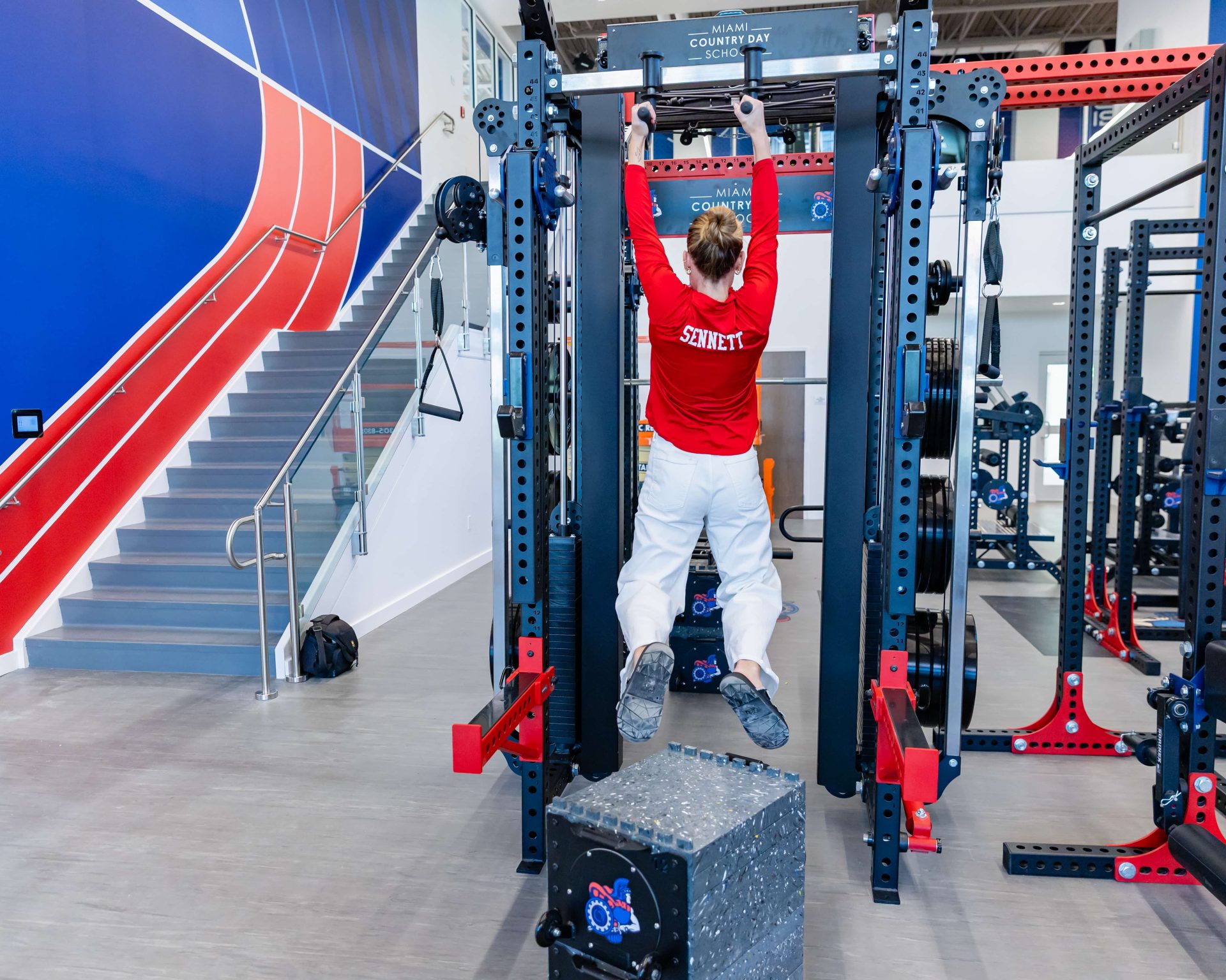 MCDS student using gym equipment, Student Health Giving page card