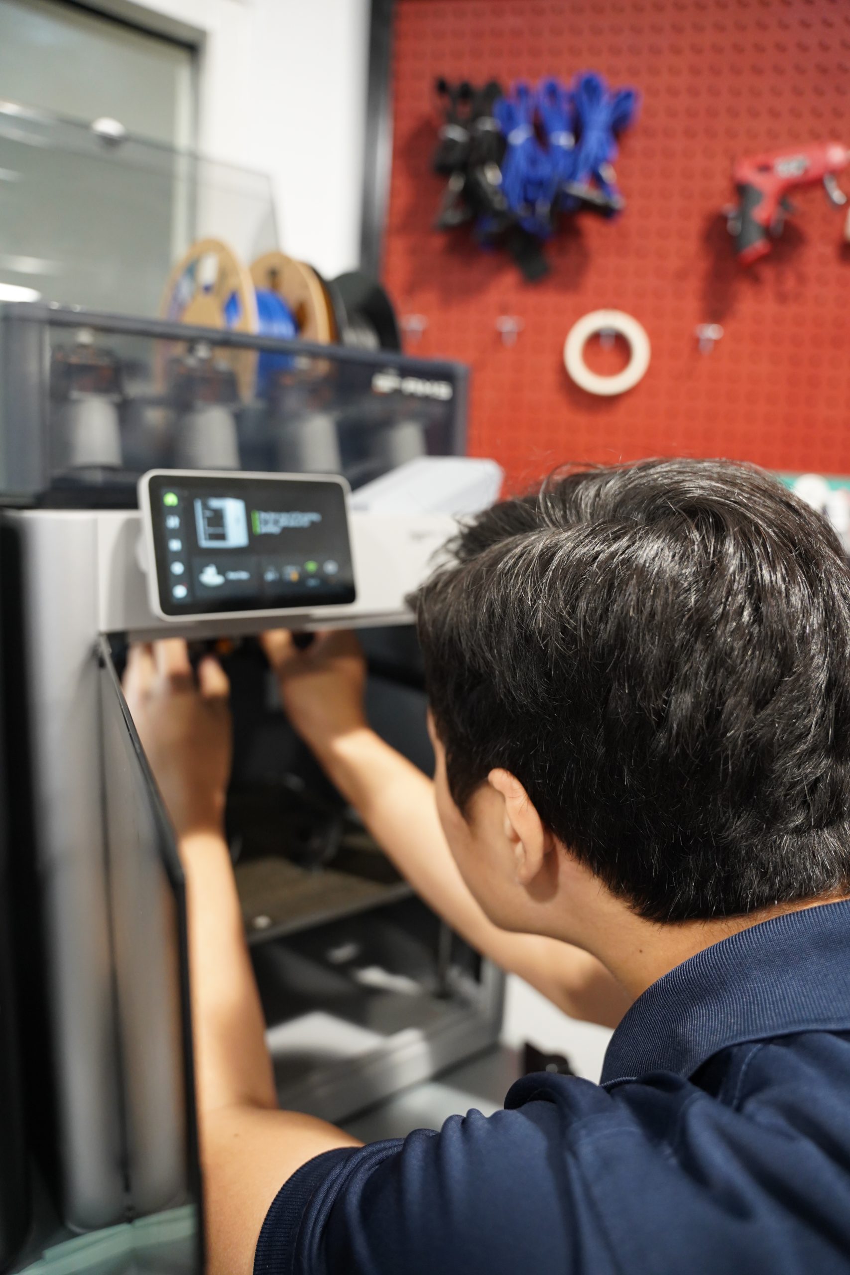 MCDS student recording video, shown on the Robotics Teams page