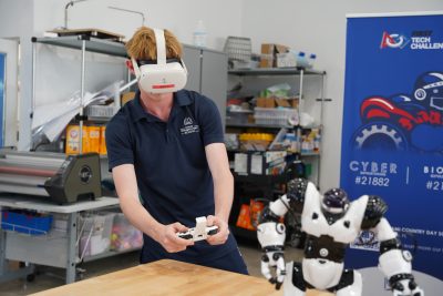 MCDS student working on a robotics project, shown on the EI² Honor Society page