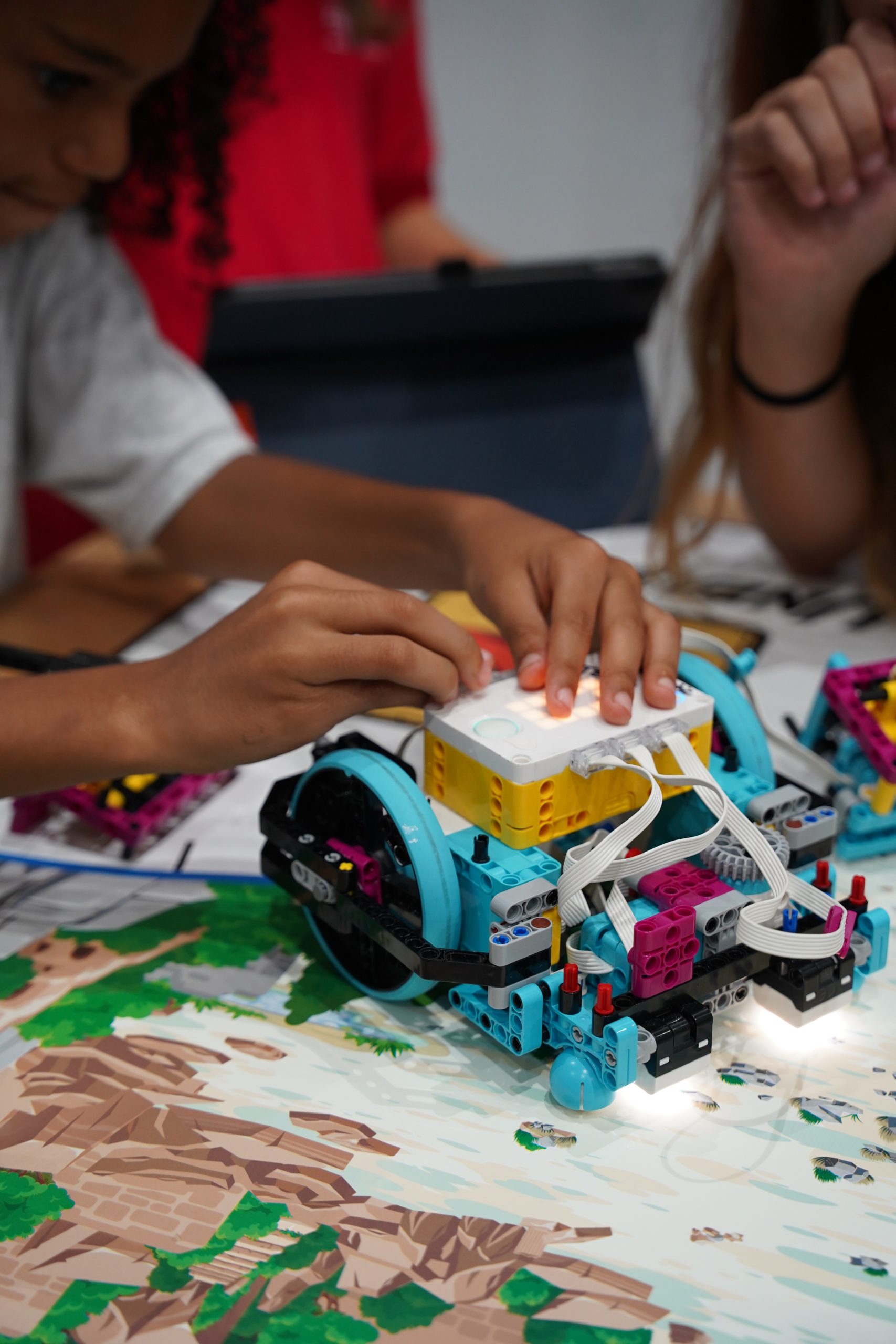 MCDS students working with colorful craft materials, shown on the EI² Honor Society page