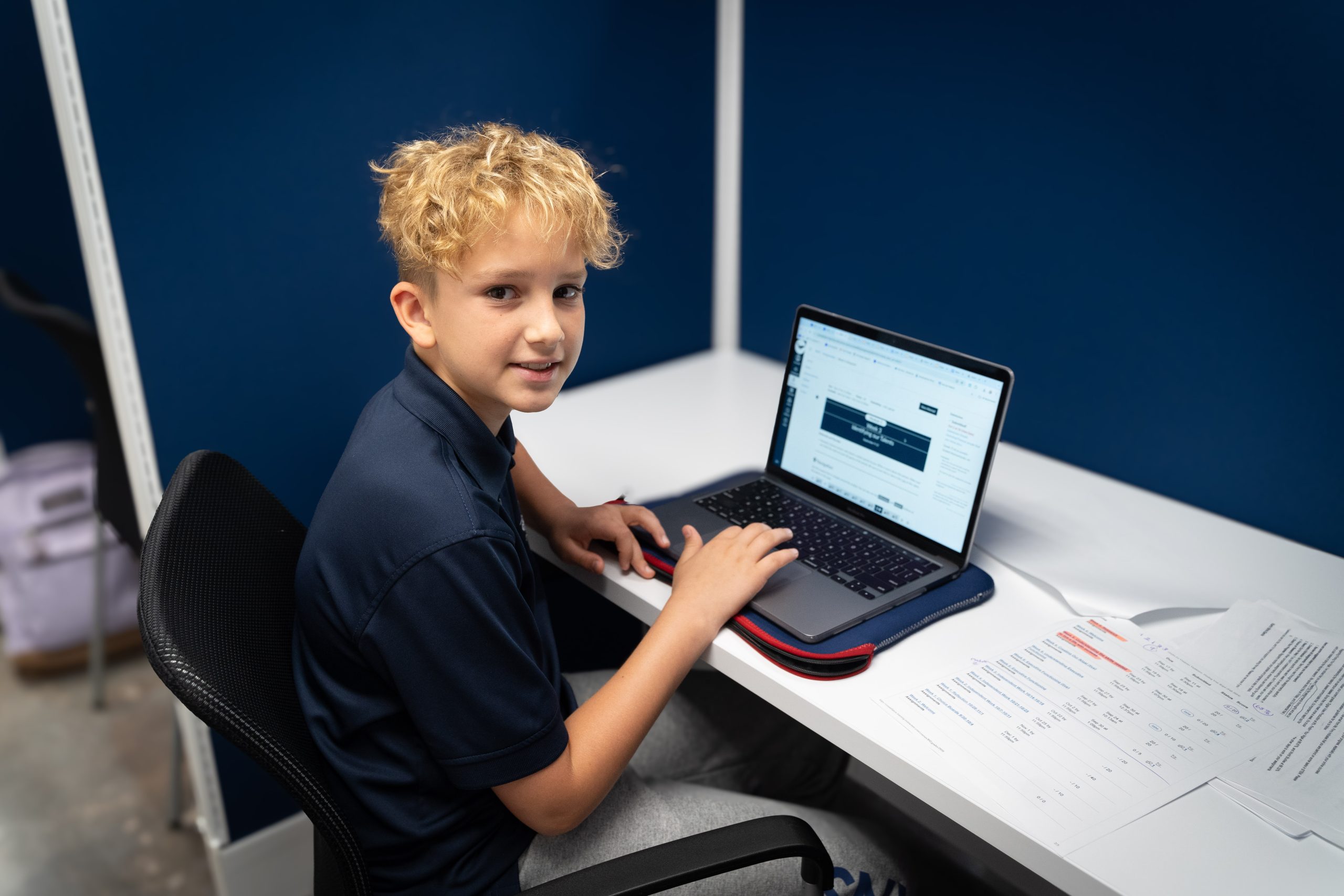 MCDS Online School student working on a laptop