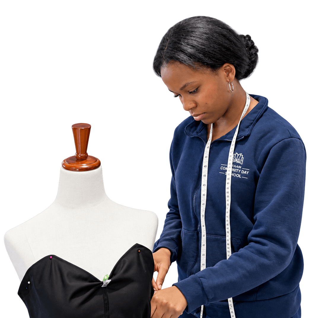 MCDS student working with a dress form, Impact Studio program
