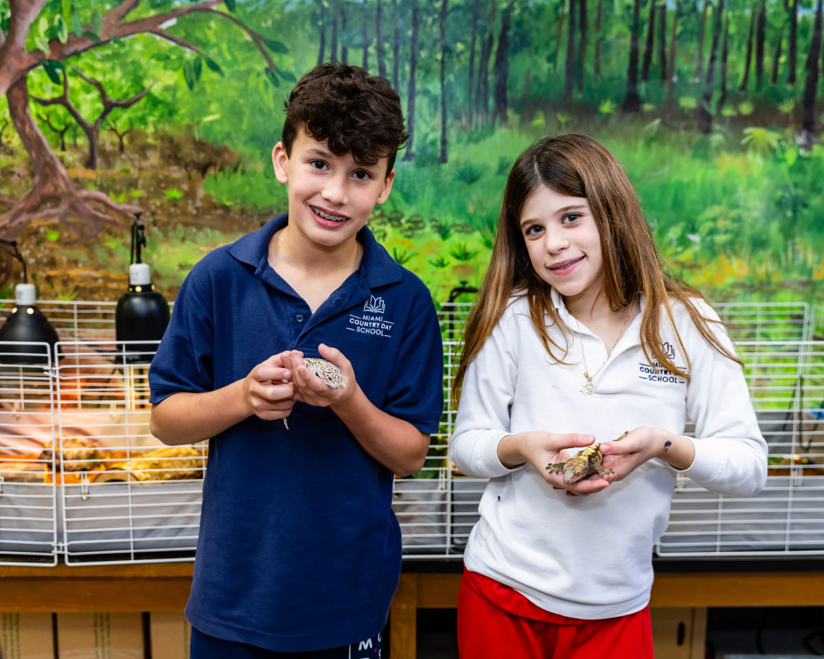 Lower School students examining items outdoors during an ACES science activity