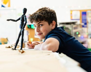 Middle School students participating in a club activity