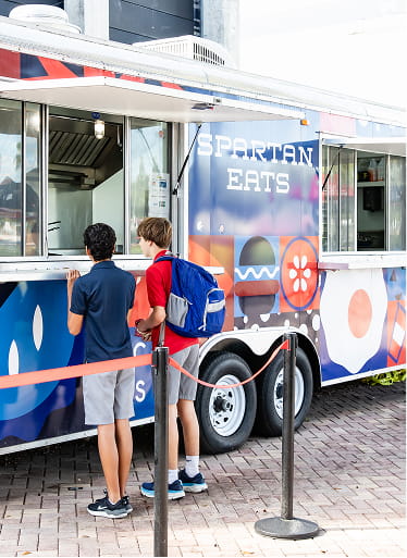 Pool-side food truck dining venue at MCDS, part of SAGE Dining Services
