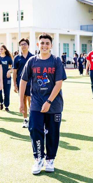 MCDS students walking on campus, shown on the Academics page