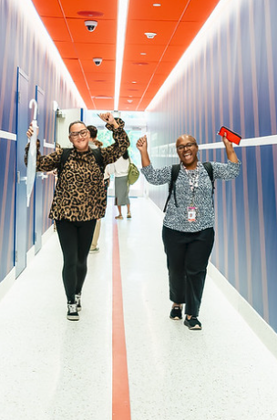 MCDS staff members walking together through a school hallway
