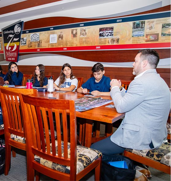 MCDS College Counseling advisors meeting around a conference table